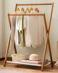 Lukzer X-Shape Bamboo Clothes Rack with Double Hanging Rods & Storage Shelf | Freestanding Garment Organizer Stand | Foldable, Durable, Multipurpose Clothing Rack for Bedroom, Hallway & Laundry Room.